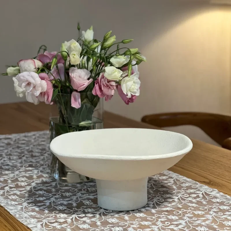a minimal clay pot near a flower pot